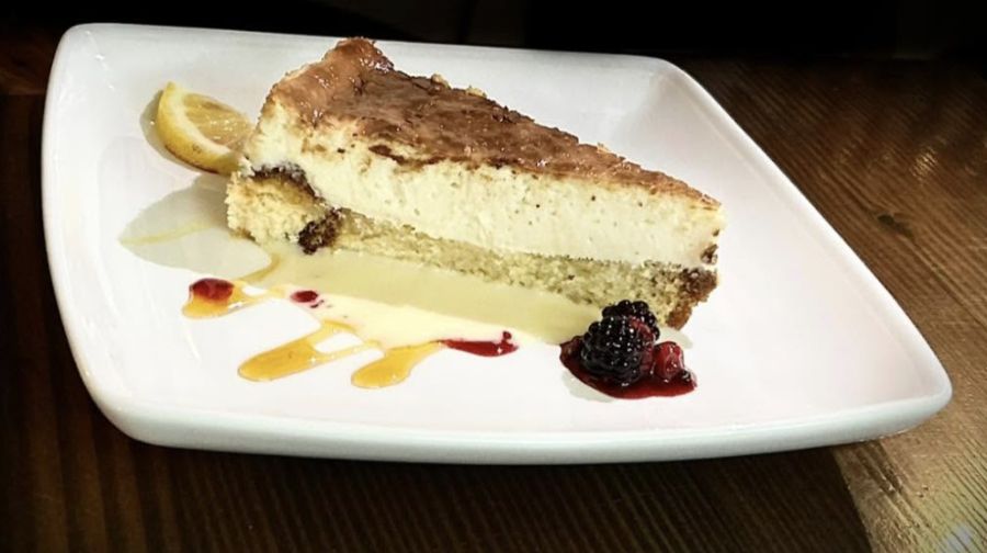 A plated slice of cheesecake dessert